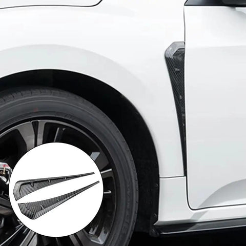Tesla Cybertruck Side Fender Vent Trim Rocking A Slick Carbon Fiber Peel And Stick Exterior Accent Kit For Clean Street Style Upgrades and Super Fast No Mess Install on a white vehicle.
