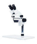 Professional Binocular Stereo Microscope 7X to 45X Zoom With LED Ring Light, Dual Coarse and Fine Focus, Wide Base for PCB Repair, Jewelry, Minerals, and Precision Inspections. White stereo microscope with dual eyepieces and wide base.