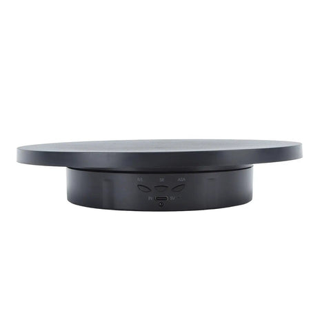 Must Have Remote Controlled 360 Rotating Turntable For Jewelry Photography And Live Streaming With Adjustable Speed Silent Motor Operation, black top view with control panel.