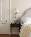 Classic Swing Arm Wall Sconce Featuring Distressed Bronze Finish One Light Adjustable Vanity Lamp 10 By 29 Inches Rustic Home Decor beside bed.