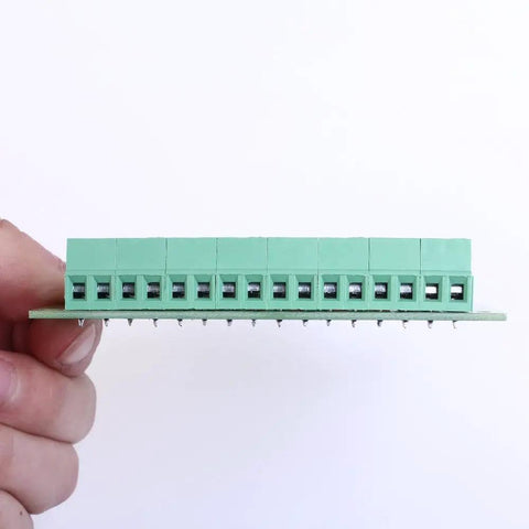 Close-up view of 8 Channel Voltage Level Converter Module From 24V To 3V3 For MCU And PLC PNP NPN Signal Translator Handy PCB Board held by hand