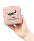 Hand holding Pink Compact Jewelry Travel Case With Plush Lining Carry On Friendly Mini Jewelry Organizer For Purse Or Backpack