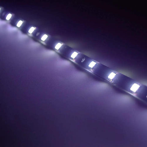 Close-up of glowing 12V Waterproof LED Underbody Light Strip Kit 1 Ft Length 12 LEDs Per Strip Self Adhesive for cars and motorbikes
