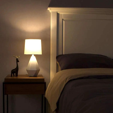 Modern White Ceramic Table Lamp With Irregular Geometric Base And White Fabric Shade Compact Nightstand Bedside