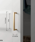 5 Inch Champagne Bronze Cabinet Pull Handles 6 Pack With Grooved Texture And Non Slip Grip installed on white cabinet door.