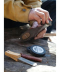Using Dual Grit Ceramic Grinding Puck For Axes Whetstone 300 600 on axe outdoors for maintenance