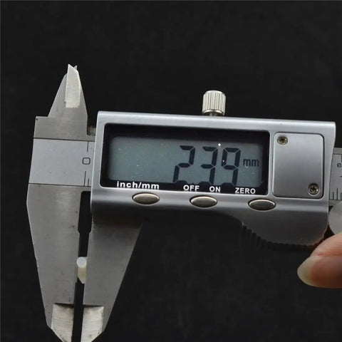 Digital caliper measuring 23.9mm displaying precision on screen, ideal for sizing M2.5 Nylon Hex Standoff And PCB Spacer 100 Piece Pack White 94V2 Flame Resistant.