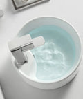 Straight Fire 15.7 Inch Diameter Round Ceramic Bathroom Vessel Sink With Integrated Faucet For Above Counter Installation And Quick Room Glow Up In Crisp White Finish, showcasing water reflecting light.