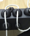 Self Adhesive Black Silicone Cable Clips Organizer Pack Of Six For USB Charging And Network Cables Headphone Cables And More Cord Management Mounts For Car Desk Office And Home securing cables on a desk