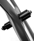 Close-up of Carbon Tri-Spoke Road Wheelset 700c Tubeless Ready 55/25mm Profile UD Matte Toray T700 Rim with hub details