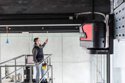 Knockout Green Beam Cross Line Laser Level For Hella Visible Layout Marks And Super Sharp Wall Grids With Effortless Drywall Tiling Setup On Tough Jobs projecting a green line on a wall.