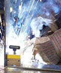 MagSquare magnetic welding clamp used for precise welding alignment and fixturing, highlighting sparks and sturdy grip with on/off capability.