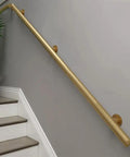 Tough As Nails Metal Handrails Built To Last, golden adjustable rail mounted along stairs for safety and support.