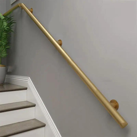 Tough As Nails Metal Handrails Built To Last, golden adjustable rail mounted along stairs for safety and support.