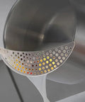2 Pack Stainless Steel Pot Strainer Set With Safe Handles For Hands Free Drainage shown draining pasta water hand-free