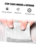 Two Rolls Butyl Repair Tape Sealant For Roof Leaks, Pipe Cracks, And Outdoor Surfaces being stretched to show flexibility
