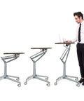 Totally Adjustable Pneumatic Sit Stand Rolling Laptop Desk Cart with ergonomic walnut platform and adjustable height.