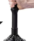 Hand using No Sweat Bellows Toilet Plunger with 21 inch handle for stubborn blockages and low flow drains.