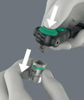 Zyklop Speed Black Edition 8000 A Professional Ratchet Set With Green Finish, quick-change socket detail being attached by hand.