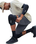 Model wearing Oseus VPD Knee Pads For Mountain Biking And Enduro, certified MTB knee protection, in all weather flexible armor.