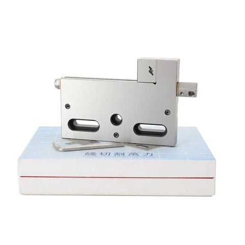 Beefy High Precision 4 Jaw Wire EDM Vise with stainless steel jaws on box, 0 to 100mm opening range, metalworking tool for EDM and milling