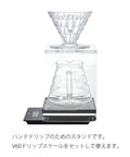 Clear Acrylic V60 Coffee Dripper Stand With Built In Drip Catcher Tray And Sturdy Pour Over Support Rack For Home Barista Brew Setup with kettle.