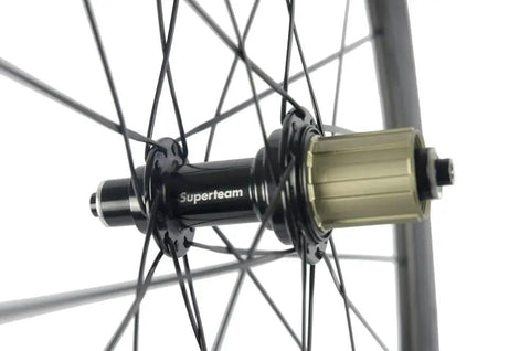 Close-up of Beast 50mm Carbon Basalt Braking Surface Clincher Road Wheelset 700c hub detail with spokes and matte 3k finish.