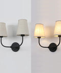 Two Light Wall Sconces With Funnel Linen Fabric Shades Vintage Modern Metal Wall Lamps unlit and lit in neutral setting side by side