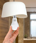Lit A19 LED Bulbs 150 Watt Equivalent 5000K Daylight E26 Base 15W 1600 Lumens in hand under lampshade