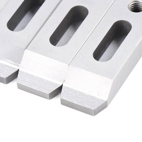 Close-up of Set Of 4 Magnetic Jig Clamps For Wire EDM Fixture Boards In Stainless Steel With M8 By 1.25 Screws, showing pads