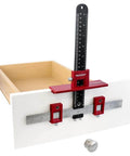Adjustable Drill Guide Hardware Jig For Cabinet Handles Knobs And Drawer Pulls Installations With Repeat Drilling Reversible Left To Right Transfer Sliding Stops And 5mm Bushings For Fast No Brainer Setup shown installed on a drawer front.
