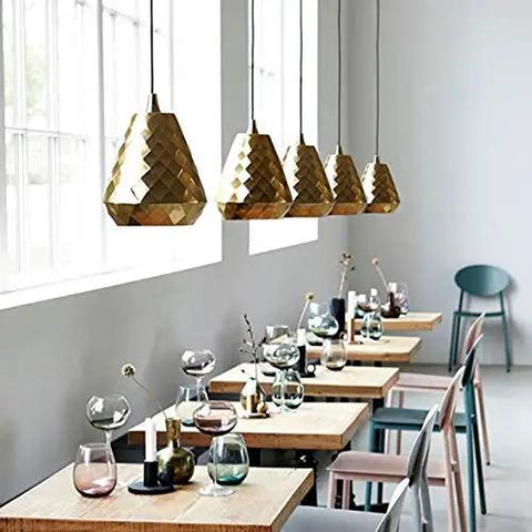 Slap This Modern Single Head Wall Sconce On Your Space And Watch The Vibes Level Up Featuring Sleek Polished Iron Build And Minimalist Aesthetics Ideal For Restaurants Bars And Bedrooms with gold pendant lights and wooden tables.