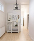Six Light Black Modern Farmhouse Square Pendant Chandelier For Foyer Hallway Stairway Kitchen Island Dining Living Room 15.75 Inch Wide 22.4 Inch High With 35.4 Inch Chain Length hanging in a modern white hallway.