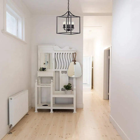 Six Light Black Modern Farmhouse Square Pendant Chandelier For Foyer Hallway Stairway Kitchen Island Dining Living Room 15.75 Inch Wide 22.4 Inch High With 35.4 Inch Chain Length hanging in a modern white hallway.