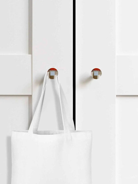 Sweet Abstract Art Solid Beech Wood Cabinet Knobs featuring 1.6 inch round profile on white cabinet with tote bag.