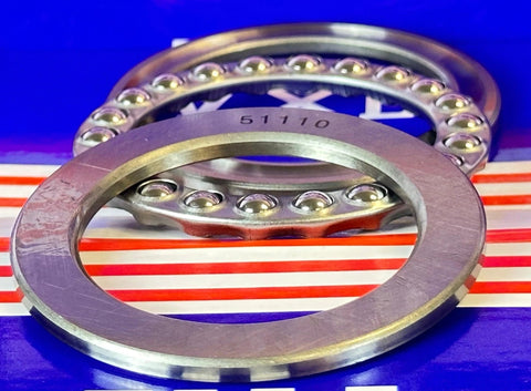Close-up of 51110 Thrust Bearing 50x70x14mm showing chrome steel rings and ball bearings on a blue-striped background.