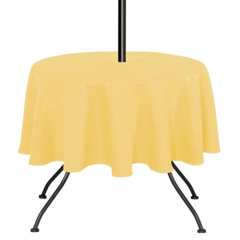 Yellow 60 Inch Round Outdoor And Indoor Tablecloth With Umbrella Hole And Zipper Wrinkle Free Washable Waterproof Round Table Cover For Spring Summer Patio Picnics BBQs Parties on a table.