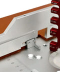 Close-up of Rock Solid Aluminum Router Table Insert Plate Set showing precise markings and alignment features for wood milling.