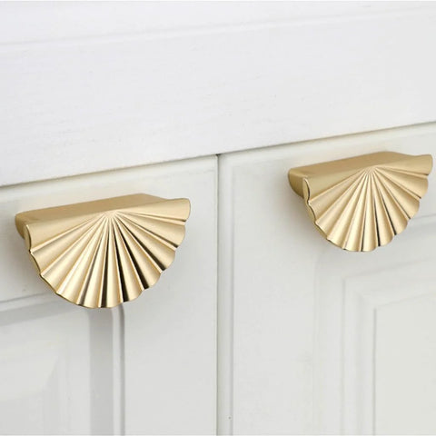 Semicircle Sunflower Cabinet Pulls In Brushed Gold Finish 6 Pack installed on white cabinets