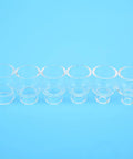 Six clear glass nozzles from Pro Grade Glass Nozzle Kit For WP9 20 Argon Welding Torch, displayed on a blue background.