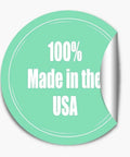 Round sticker with "100% Made in the USA" text on a light teal background, partially peeled edge.