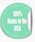 Sticker reading '100% Made in the USA' on green background, partially peeled and curled edge visible.