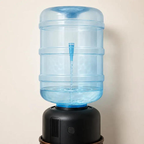 5 Gallon BPA Free Water Bottle Reusable Jug With Large Capacity Polycarbonate Container Universal Top Load And Bottom Load Dispenser Compatibility For Home And Office Use on a dispenser.