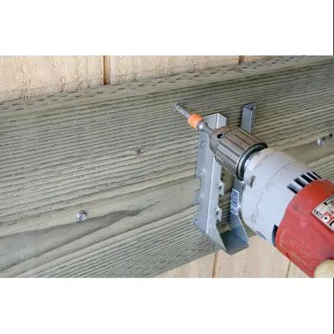 1/4 Inch By 2 Inch Structural Stainless Steel Wood Screw With 3/8 Inch Hex Head And Integrated Washer being installed in wood