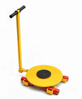 Badass Machine Skate Rated For 12 Ton Loads Featuring Rugged Carbon Steel Construction And Dual Ball Bearing Rollers, yellow round platform with handle.