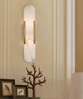 Backplate Sconce With Alabaster Shade Modern Bathroom Wall Light Sleek Design and Thick Backplate Wrapped Center on wall