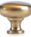 Front view of Six Pack One And One Quarter Inch Champagne Bronze Zinc Alloy Cabinet Knobs With Single Hole Center Mount Satin Brass Cabinet Pull Hardware for Kitchen Bedroom Closets Drawers And Dressers.