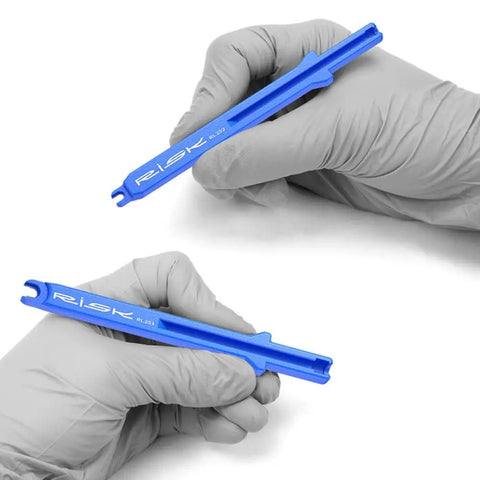 Hands holding blue tools from Electronic Shift Cable Installation Tool Kit Pro Grade For Shimano Di2 11 12 Speed SD50 SD300