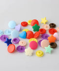 Colorful T5 snaps assortment from Snap Kit With Pliers, 473 Pcs T5 Snaps For DIY Sewing And Crafting, versatile shapes and colors.
