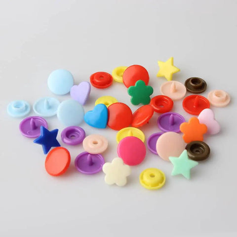 Colorful T5 snaps assortment from Snap Kit With Pliers, 473 Pcs T5 Snaps For DIY Sewing And Crafting, versatile shapes and colors.